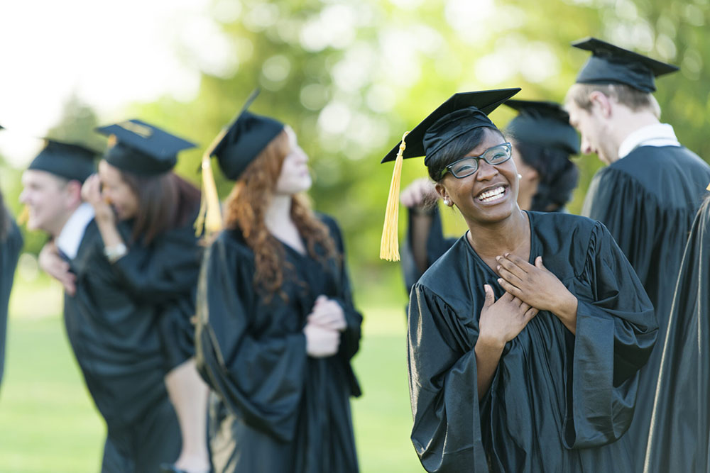 Graduates smiling and celebrating