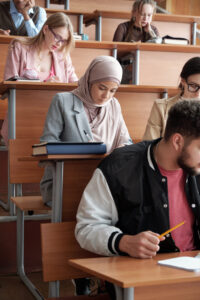 Students in a classroom taking notes.