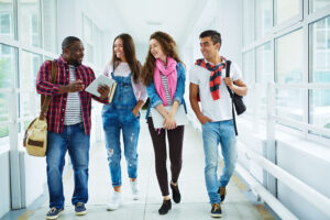 Students Walking down a Campus Hallway